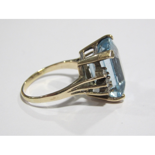 55 - An eighteen carat gold blue topaz and diamond set dress ring