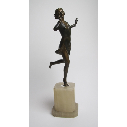 561 - An Art Deco painted spelter figure of a young woman