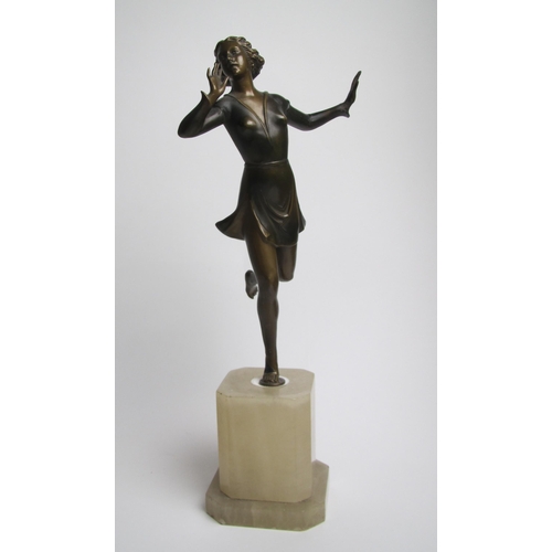 561 - An Art Deco painted spelter figure of a young woman