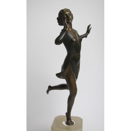 561 - An Art Deco painted spelter figure of a young woman