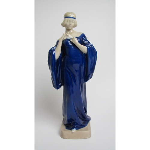 571 - A continental porcelain figure of a lady