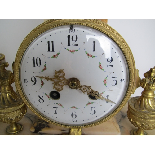 584 - A Louis XVI style marble and gilt metal clock garniture