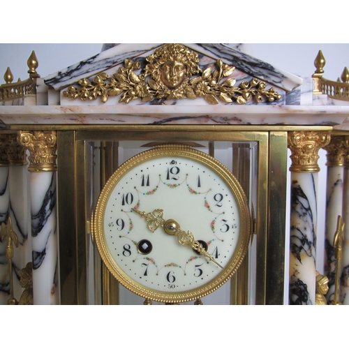 585 - A Louis XVI style marble and gilt metal clock garniture