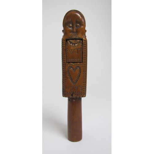 587 - An 18th Century fruitwood nutcracker