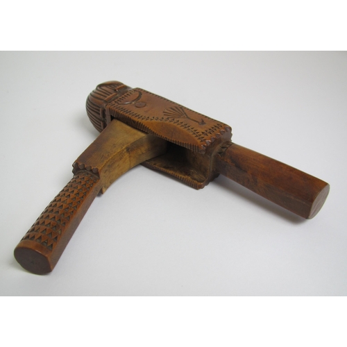 587 - An 18th Century fruitwood nutcracker