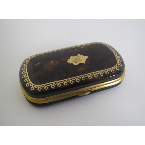 590 - A tortoiseshell and brass purse