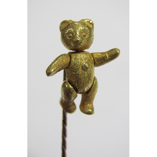 60 - A gold stick pin  with hallmarked 18 ct gold teddy