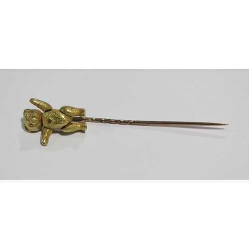 60 - A gold stick pin  with hallmarked 18 ct gold teddy