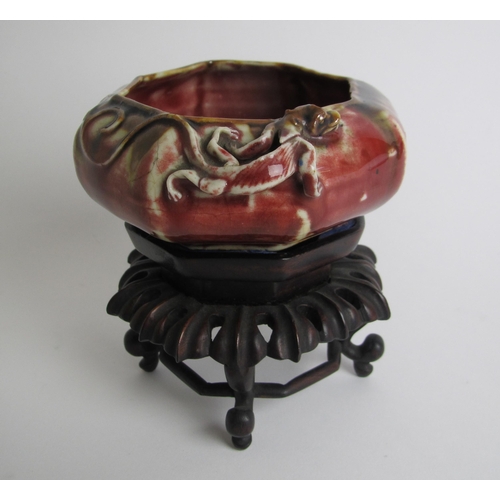 606 - A Chinese octagonal red mottled bowl