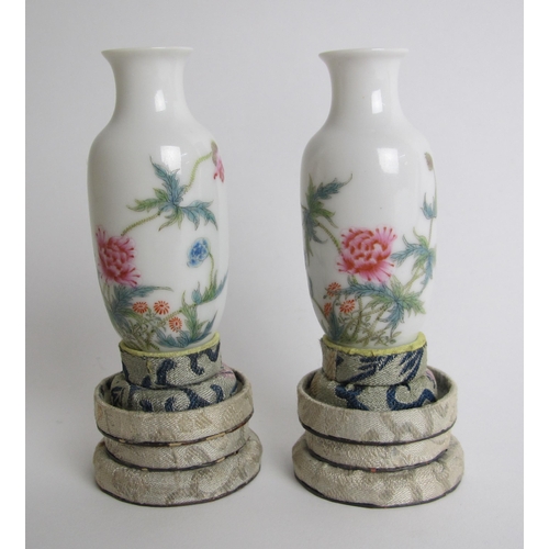 610 - A pair of Chinese eggshell miniature baluster vases