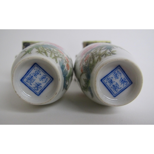 610 - A pair of Chinese eggshell miniature baluster vases