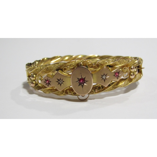 62 - A Victorian gold ruby and diamond set bangle