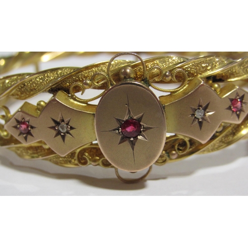 62 - A Victorian gold ruby and diamond set bangle