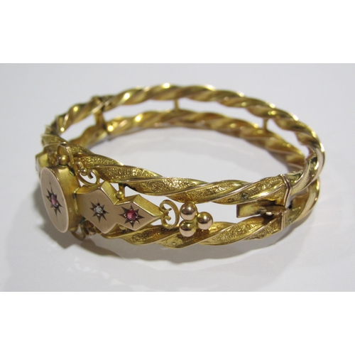 62 - A Victorian gold ruby and diamond set bangle