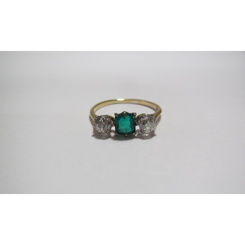 62A - An Edwardian 18 ct gold emerald and diamond three stone ring