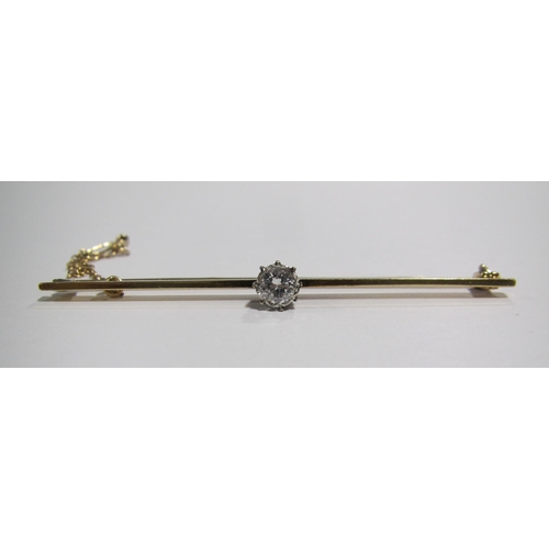 64 - An early 20 th century 18 ct gold and platinum diamond set bar brooch