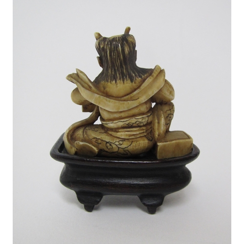 657 - A Japanese carved ivory oni