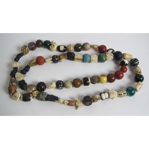 661 - An interesting necklace containing beads from Japan  China and Egypt