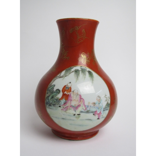 681 - A Chinese red ground baluster vase