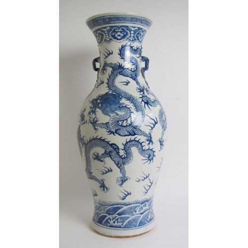 683 - A Cantonese famille rose vase painted with panels of figures