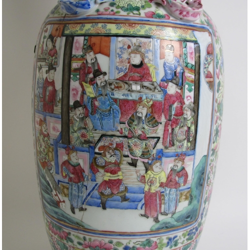 683 - A Cantonese famille rose vase painted with panels of figures