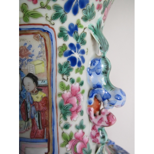 683 - A Cantonese famille rose vase painted with panels of figures