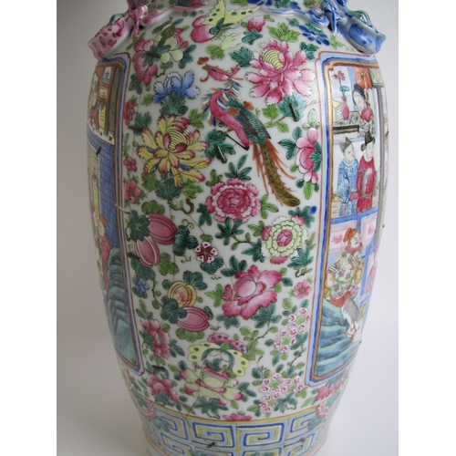 683 - A Cantonese famille rose vase painted with panels of figures