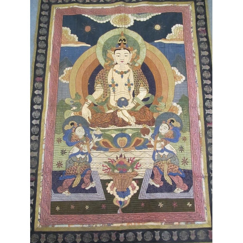 702 - A Buddhist silk embroidered wall hanging