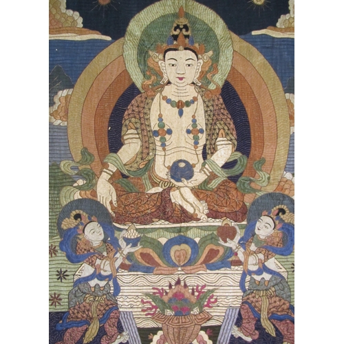 702 - A Buddhist silk embroidered wall hanging