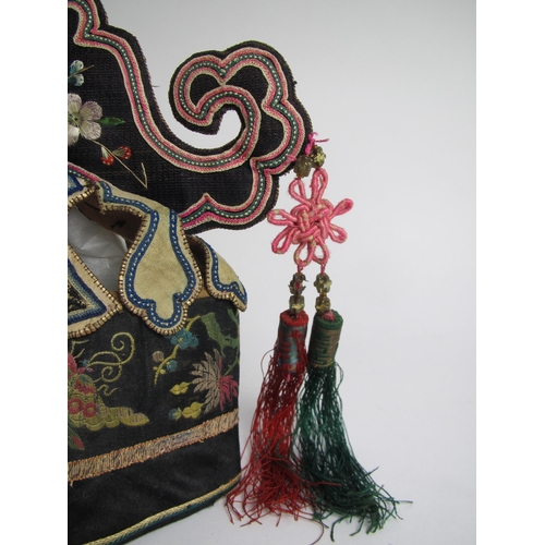 708 - A festive headdress of coloured silks