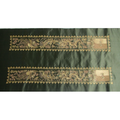 715 - A pair of green silk and gold embroidered sleeve panels