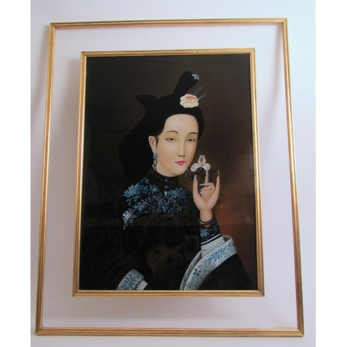 746 - A Chinese reverse painted portrait of a beauty