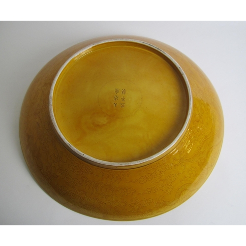 748 - A large Chinese yellow ground circular dish