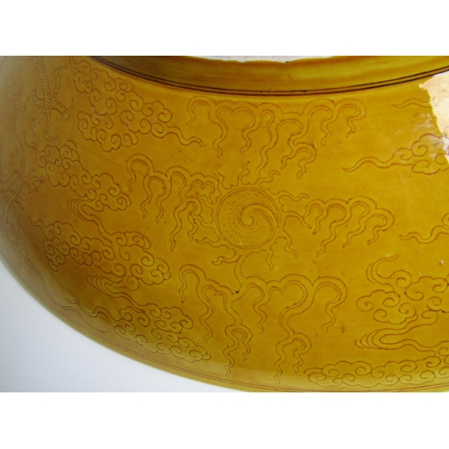 748 - A large Chinese yellow ground circular dish