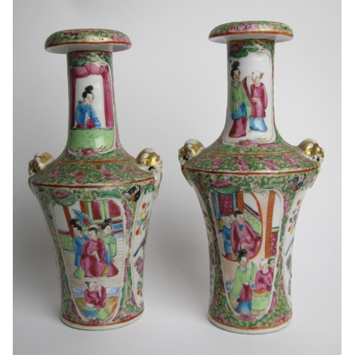 749 - A pair of Canton famille rose baluster vases