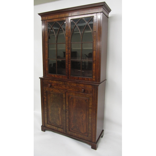 784 - A William IV mahogany secretaire bookcase on cupboard base