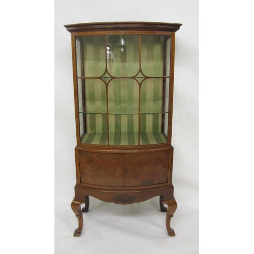 788 - An Edwardian mahogany inlaid bow fronted display cabinet