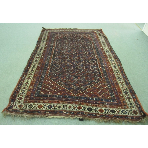 802 - A Persian multi coloured floor rug