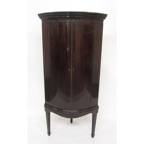 815 - An Edwardian mahogany inlaid corner cupboard