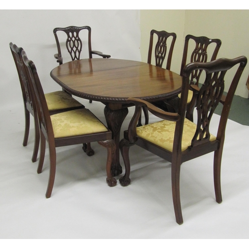 833 - A reproduction Chippendale style mahogany extending dining table