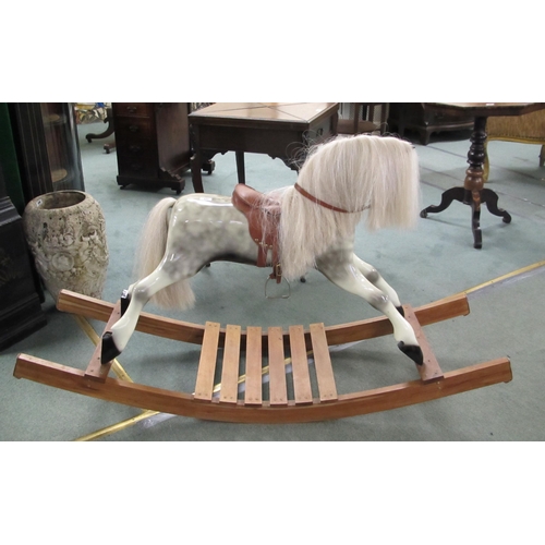 841 - A hand carved dapple grey rocking horse