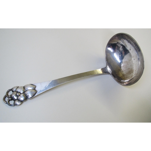 205 - A Danish silver hammered soup ladle