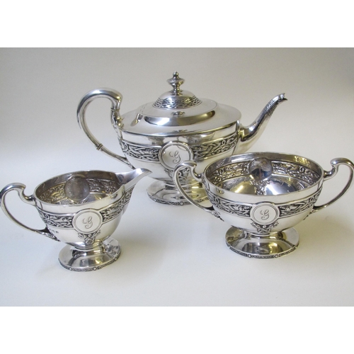 206 - A Silver Celtic pattern three piece silver tea service