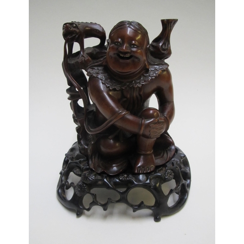 247 - A Chinese hardwood figure of Hotei