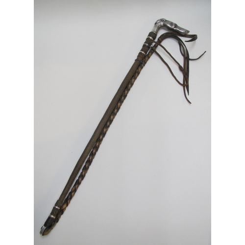 251 - A white metal mounted riding crop