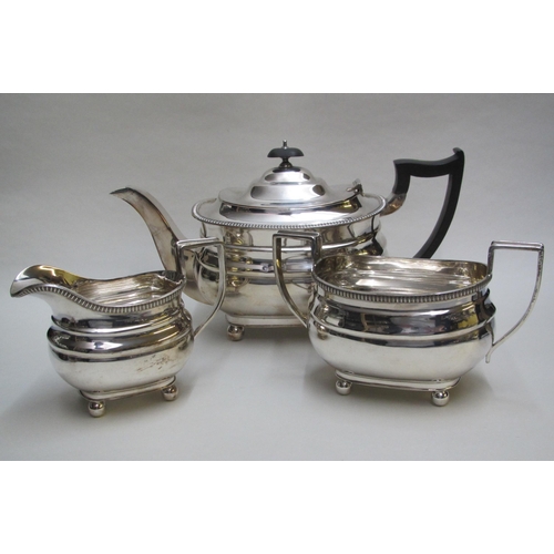 253A - A silver three piece tea service