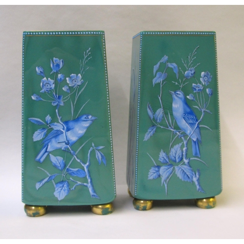 489 - A pair of green glass square tapering vases