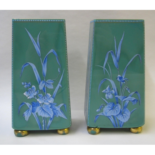 489 - A pair of green glass square tapering vases