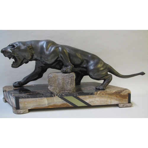 519 - An Art Deco spelter model of a jaguar