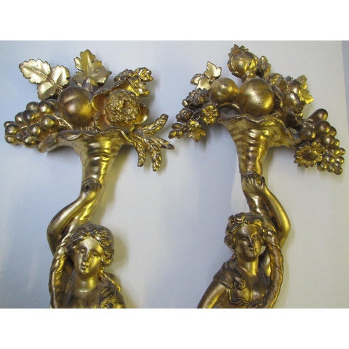 520 - A pair of gilt wood appliques